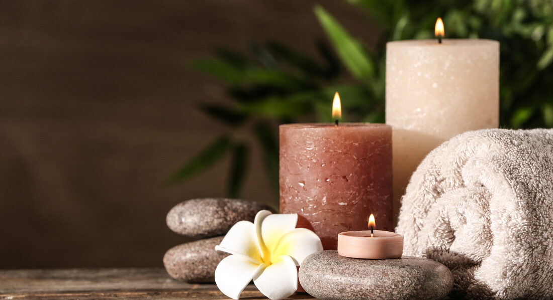 A calm, softly lit salon treatment room with a folded white towel